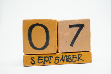 september 7th. Day 7 of month, handmade wood calendar isolated on white background. autumn month,...