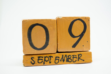 september 9th. Day 9 of month, handmade wood calendar isolated on white background. autumn month, day of the year concept