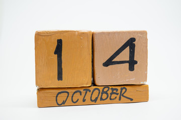october 14th. Day 14 of month, handmade wood calendar isolated on white background. autumn month, day of the year concept