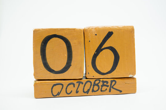 october 6th. Day 6 of month, handmade wood calendar isolated on white background. autumn month, day of the year concept