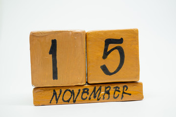 november 15th. Day 15 of month, handmade wood calendar isolated on white background. autumn month, day of the year concept