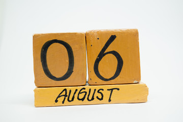 august 6th. Day 6 of month, handmade wood calendar isolated on white background. summer month, day...