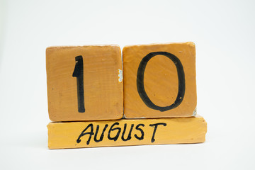 august 10th. Day 10 of month, handmade wood calendar isolated on white background. summer month, day of the year concept