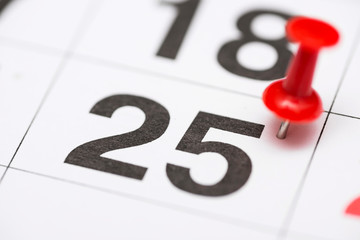 Pin on the date number 25. The twenty fifth day of the month is marked with a red thumbtack. Pin on...