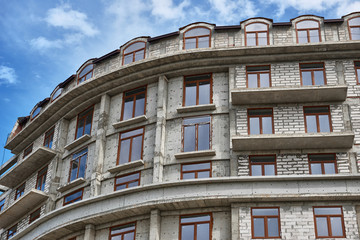 new building under construction, scaffolding and concrete
