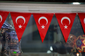 Triangle shaped Turkish national flags attached  to a rope