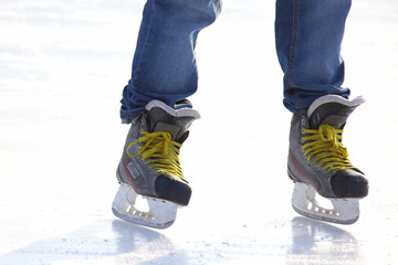 Feet skating on the ice rink