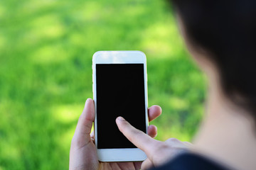 Young women's hands holding smartphone.