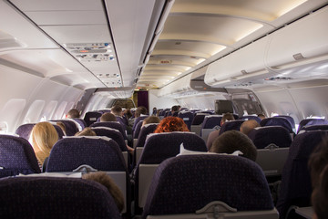 interior of a plane with people