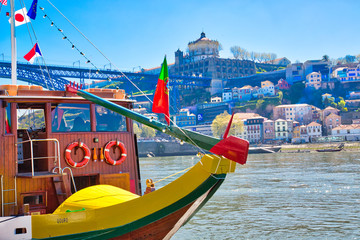 Porto, Portugal-14 October, 2018: Famous colorful boats providing tours along banks of Rio Douro