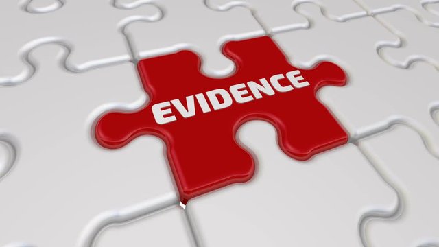 Evidence. The inscription on the missing element of the puzzle. Folding white puzzles elements and one red with the word EVIDENCE. Footage video