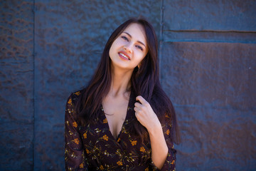 Fototapeta premium Beautiful brunette woman in sexy brown dress