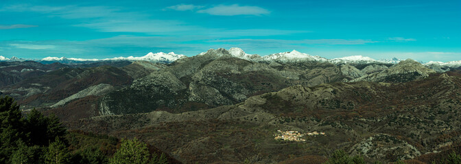 panorama snowy mountain top on sunny day in spain