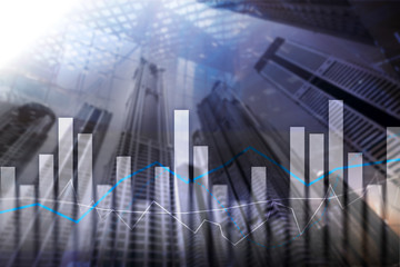 Financial graphs and charts on blurred business center background. Invesment and trading concept