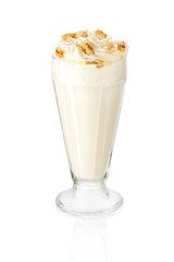 A delicious cold milk shake decorated with walnuts. Isolated on white.