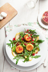 Goat cheese, garden rocket and pomegranate salad.