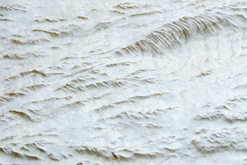 Natural limestone with wavy relief surface like chain of mountains from above
