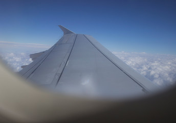 Fototapeta na wymiar airplane in the sky and airplane window
