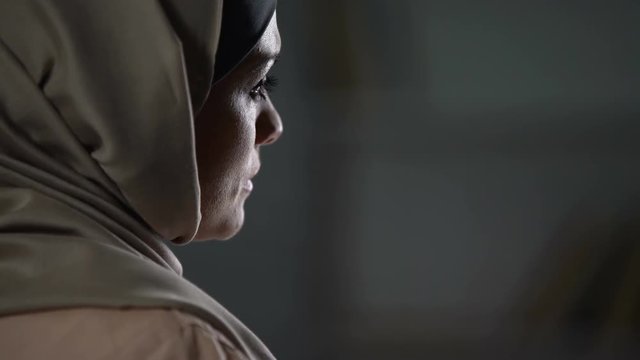 Unhappy arab woman in hijab close-up, pessimistic mood, sorrow, melancholy