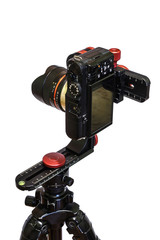 panoramic head for a tripod for the making of virtual tours and full seamless 360 degrees angle panoramas without parallax and distortion isolated on white background with mirrorless camera
