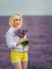 Young girl posing in a lavender field.