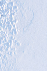 Abstract patterns on wind blown snow surface.