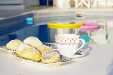 Turkish cake and coffee by poolside