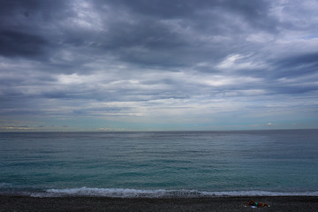 Sea view from  beach with cloudy sky. Summer paradise beach .  Exotic summer beach with clouds on horizon. Ocean beach relax, outdoor travel -