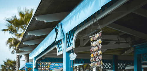 Bar on the beach decorated with seashells and inscription relax, the Adriatic coast. toned
