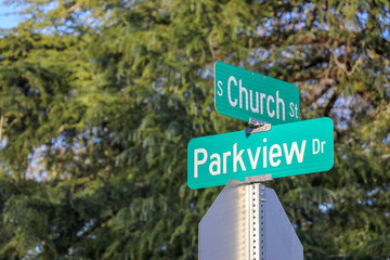 street signs at an intersection of church and parkview