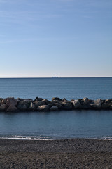 sea and rocks,container ship,seascape,beach,horizon,sky,blue