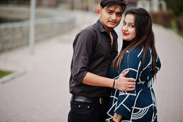 Love story of indian couple posed outdoor.