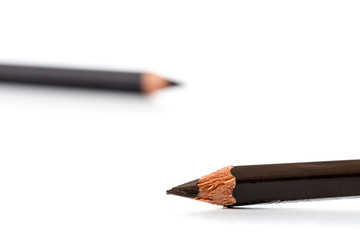 Black pencil for eyes. Realistic eyeliner with cap. Decorative cosmetic product - liner for beautiful makeup, on white background.