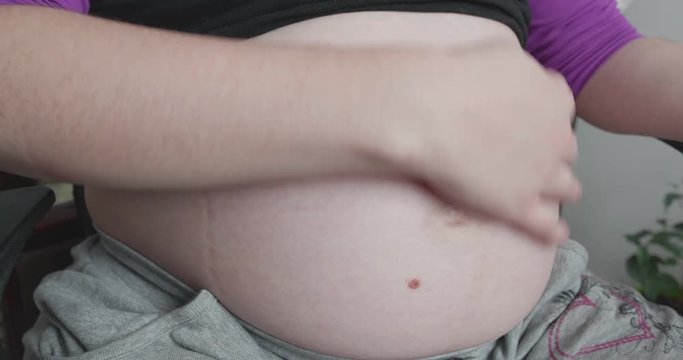 Pregnant Woman Strokes Tummy