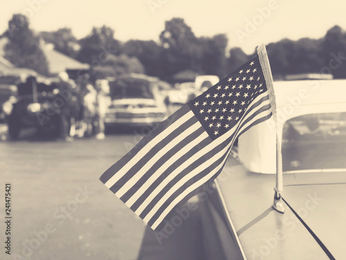 Vintage American Flag on Old Classic Car at Cruise In Car Show, Sepia Retro Style