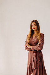Fototapeta premium attractive stylish young girl near the window in light interior