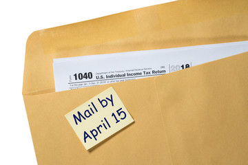 Printed copy of Form 1040 for income tax return for 2018 with reminder for April 15, 2019 deadline