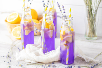 Fresh violet cocktail with lemon, ice and lavender