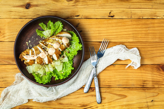 Chicken salad with pineapple, lettuce, cream sauce and walnut