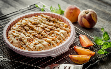 peach pie on an old wooden table