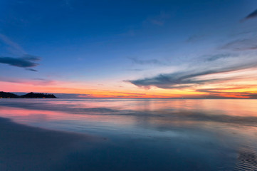 Fototapeta na wymiar Sunset ebb at tropical beach