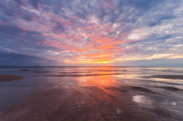 Sunset ebb at tropical beach