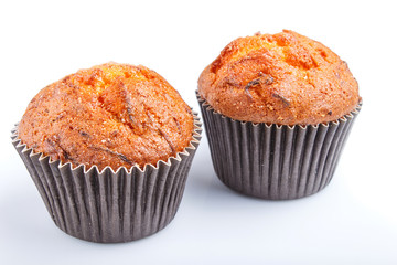two carrot muffins isolated on white background