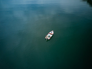 Aerial Drone image of a colorful rowboat just offshore on a Costa Rica Beach