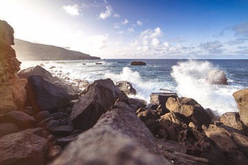 sunset on coast of sea