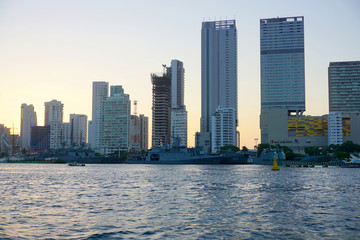 Cartagena / Colombia - 12 25 2018: Panoramic view of the coastline of the city and the sea with blue sky with some boats or ships with a sunset and buildings