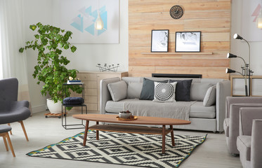 Stylish living room interior with comfortable couch and decorative elements