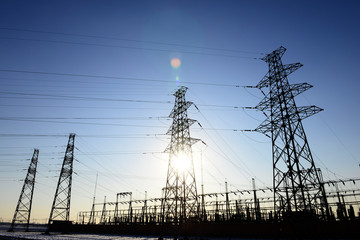 High piezoelectric towers, in the setting sun