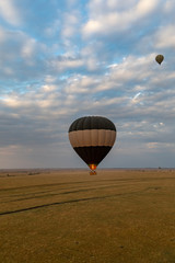 Obraz premium Hot air balloon flight over the Masai Mara, Kenya, Africa