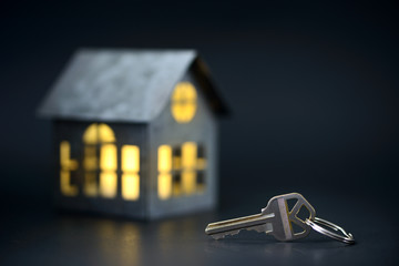 House keys with house model on the background
